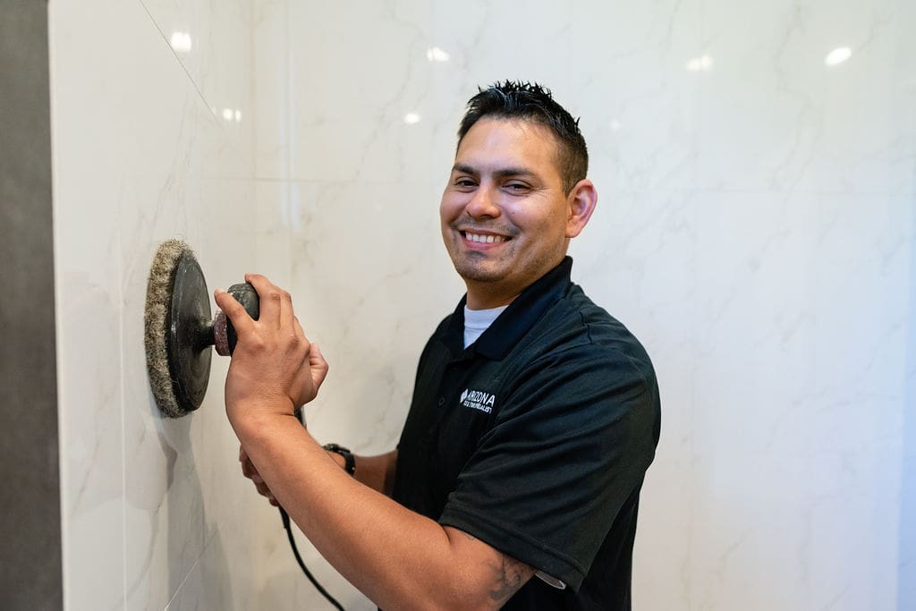 Friendly Arizona Tile & Stone Specialist Technician working on a shower